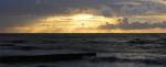 Sunset over stormy sea